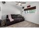 Cozy living room with a ceiling fan, couch, and home theater sign at 4749 W Beverly Ln, Glendale, AZ 85306