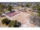 A high angle view shows a park with a basketball court, sand volleyball, and a playground perfect for community enjoyment at 4749 W Beverly Ln, Glendale, AZ 85306