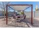 Backyard patio with pergola and seating for outdoor entertaining at 4815 E Kiva St, Phoenix, AZ 85044