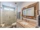 Charming bathroom features decorative mirror and a glass enclosed shower at 4815 E Kiva St, Phoenix, AZ 85044