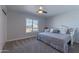 Bright bedroom features a ceiling fan and window with a view of the outdoors at 4815 E Kiva St, Phoenix, AZ 85044