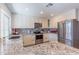 Bright kitchen featuring stainless steel appliances and white cabinets at 4815 E Kiva St, Phoenix, AZ 85044