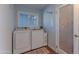 A laundry room with a washer, dryer, and a door to the pantry at 4815 E Kiva St, Phoenix, AZ 85044