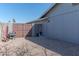 A side yard with gravel, a gate and a shed at 4815 E Kiva St, Phoenix, AZ 85044