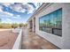 Long covered back patio with textured tile and a large picture window showcasing backyard at 529 S Val Vista Rd, Apache Junction, AZ 85119