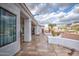 Covered back patio with tiled flooring and views of the backyard and mountains at 529 S Val Vista Rd, Apache Junction, AZ 85119