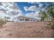 A sprawling backyard with a neutral-colored home and desert landscaping at 529 S Val Vista Rd, Apache Junction, AZ 85119