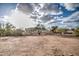 Expansive view of the backyard with mature trees and desert landscape at 529 S Val Vista Rd, Apache Junction, AZ 85119