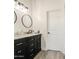 Elegant bathroom featuring a double vanity with marble countertops and modern fixtures for a luxurious experience at 529 S Val Vista Rd, Apache Junction, AZ 85119