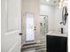 Bathroom featuring wood-style floors, black hardware, and a door to the backyard at 529 S Val Vista Rd, Apache Junction, AZ 85119