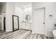 Bathroom featuring wood-style floors, white walls, white cabinets, and a full length mirror at 529 S Val Vista Rd, Apache Junction, AZ 85119