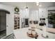 Well-organized pantry, stainless steel refrigerator, and stylish island with seating define this modern kitchen space at 529 S Val Vista Rd, Apache Junction, AZ 85119