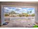 Covered tiled patio with view of the backyard and surrounding mountains at 529 S Val Vista Rd, Apache Junction, AZ 85119