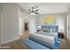 Spacious bedroom with a ceiling fan, hardwood flooring, and bright natural light offering a calming retreat at 6431 W Monte Cristo Ave, Glendale, AZ 85306