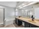 Bathroom featuring double sinks, shower, tub, and natural light at 6664 W Rose Garden Ln, Glendale, AZ 85308