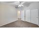 Comfortable bedroom with closet and fan at 6664 W Rose Garden Ln, Glendale, AZ 85308