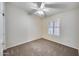 Clean and simple bedroom with plantation shutters and neutral carpeting at 6664 W Rose Garden Ln, Glendale, AZ 85308