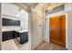 Welcoming entryway featuring tile flooring and views to the modern kitchen at 6664 W Rose Garden Ln, Glendale, AZ 85308