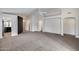 Open living room area with neutral color palette, high ceilings, and arched doorways at 6664 W Rose Garden Ln, Glendale, AZ 85308