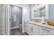 Bathroom with white vanity, updated hardware and marble countertop at 705 W Queen Creek Rd # 1059, Chandler, AZ 85248