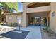 Exterior of building entrance with potted plants and accessible parking at 705 W Queen Creek Rd # 1059, Chandler, AZ 85248