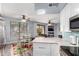 Bright kitchen and dining area with stylish floral rug and view to outdoor patio at 705 W Queen Creek Rd # 1059, Chandler, AZ 85248