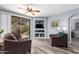 Comfortable living room with a ceiling fan and sliding glass door to a patio area at 705 W Queen Creek Rd # 1059, Chandler, AZ 85248