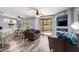 Living room with a ceiling fan, built-in shelves, and sliding glass door to the patio at 705 W Queen Creek Rd # 1059, Chandler, AZ 85248