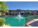 Water view of building exteriors with a water feature fountain and blue sky at 705 W Queen Creek Rd # 1059, Chandler, AZ 85248