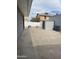 A concrete patio extends to a backyard with a shed and block wall at 730 E Dobbins Rd, Phoenix, AZ 85042