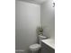 A small bathroom with white walls, updated vanity, toilet, and floral arrangement at 730 E Dobbins Rd, Phoenix, AZ 85042