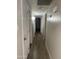 Hallway showcasing hardwood floors and doors leading to other areas of the home at 730 E Dobbins Rd, Phoenix, AZ 85042