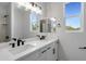 Elegant bathroom with double sinks, a large mirror, and modern fixtures at 740 W Patrick Pl, San Tan Valley, AZ 85143