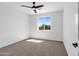 Bright bedroom with a ceiling fan and a window offering natural light at 740 W Patrick Pl, San Tan Valley, AZ 85143