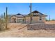 Beautiful stone-clad home featuring desert landscaping and a charming facade at 740 W Patrick Pl, San Tan Valley, AZ 85143