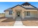 Inviting front entrance showcasing a stylish black door and stone accents at 740 W Patrick Pl, San Tan Valley, AZ 85143