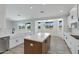 Well-lit kitchen featuring a large island, modern appliances, and views of the desert landscape at 740 W Patrick Pl, San Tan Valley, AZ 85143