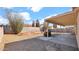 Wide view of backyard with large covered patio and gravel landscaping at 9230 W Charleston Ave, Peoria, AZ 85382