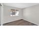 Cozy bedroom with wood-look flooring and lots of natural light at 9230 W Charleston Ave, Peoria, AZ 85382