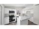 Well-appointed kitchen featuring stainless steel appliances, a center island and modern finishes at 9230 W Charleston Ave, Peoria, AZ 85382