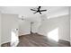 Cozy living room with wood-look floors and a stylish ceiling fan at 9230 W Charleston Ave, Peoria, AZ 85382