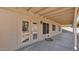 Large covered patio with french doors and neutral stucco at 9230 W Charleston Ave, Peoria, AZ 85382