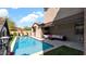 Backyard pool, covered patio with seating and turf at 9282 E Desert Vw, Scottsdale, AZ 85255