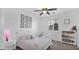 Bright bedroom with a ceiling fan and a white wood bed frame at 9282 E Desert Vw, Scottsdale, AZ 85255