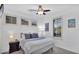 Cozy bedroom with a ceiling fan, neutral tones, and ample natural light from the window at 9282 E Desert Vw, Scottsdale, AZ 85255