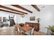 Dining room with wood beam ceiling, pendant light, and wood table at 9282 E Desert Vw, Scottsdale, AZ 85255