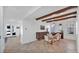 Open concept dining room with wood beams and access to multiple rooms at 9282 E Desert Vw, Scottsdale, AZ 85255