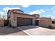 Exterior view of the home and its two car garage at 9282 E Desert Vw, Scottsdale, AZ 85255