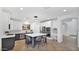 Bright kitchen with white cabinets, stainless appliances, island and tile floors at 9282 E Desert Vw, Scottsdale, AZ 85255