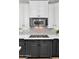 Kitchen featuring stainless steel microwave and gas stovetop with decorative tile backsplash at 9282 E Desert Vw, Scottsdale, AZ 85255